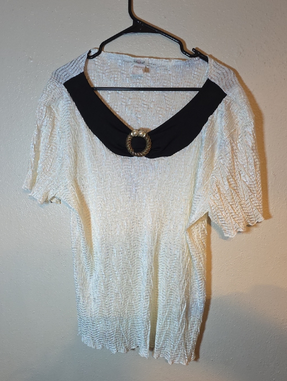 Cream Textured Blouse with Black Collar and Gold Ring Accent